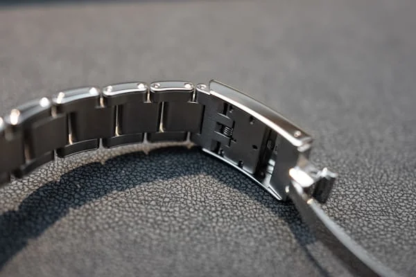 Close-up of Tudor Black Bay GMT bracelet clasp mechanism with micro-adjustments visible