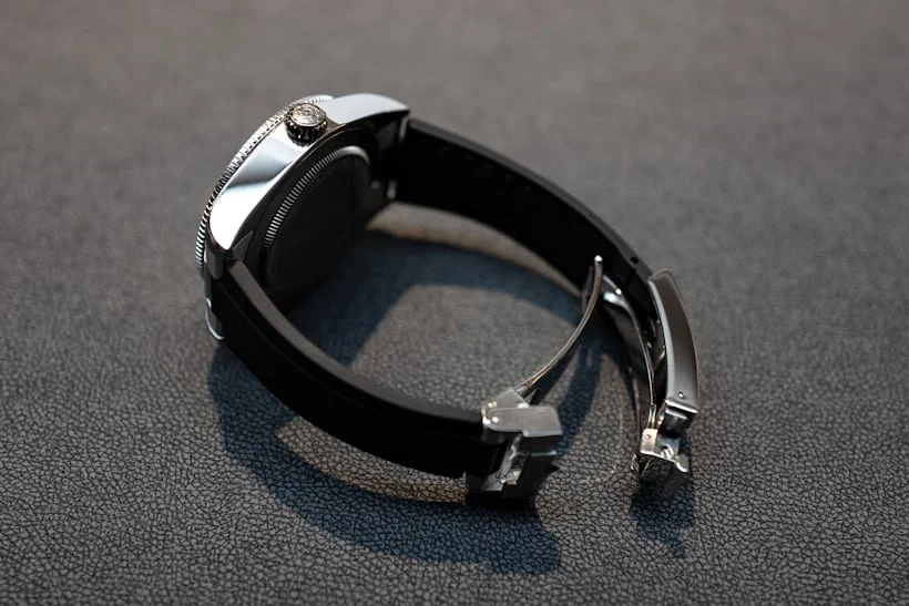 Tudor Black Bay GMT on black rubber strap with open folding clasp, side profile